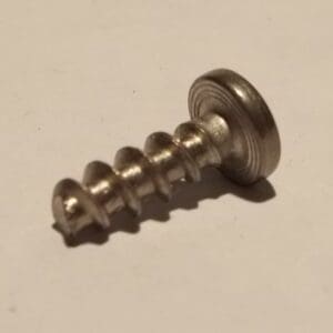 Close-up of a metal screw on surface.