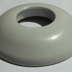 Gray plastic ring on white surface.