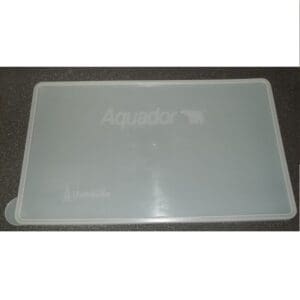 White Aquador cutting board on dark surface.