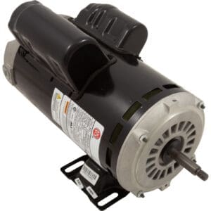 Electric motor with attached capacitor and label.