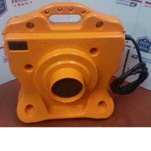 Orange air mover on a wooden surface.