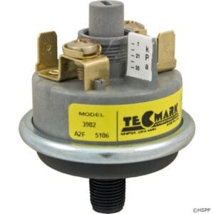 Pressure switch with yellow Tecmark label.