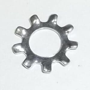 Metal gear-shaped washer on white background.