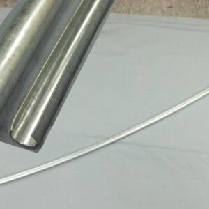 Metal pipes and a thin, curved rod.