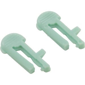 Two green plastic tile leveling clips.