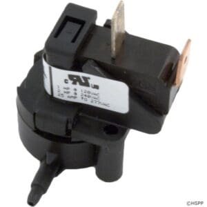 Black electrical component with metal prongs.