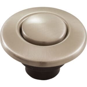 Round silver sink drain button stopper.