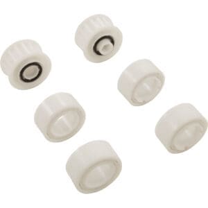 White plastic rollers on a plain background.