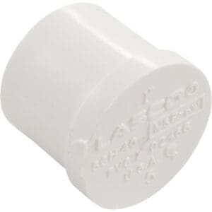 White PVC pipe end cap fitting.
