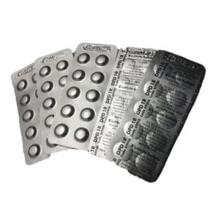 Blister packs of medication tablets fanned out.