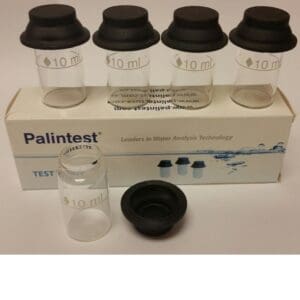 Palintest test tubes with black lids.